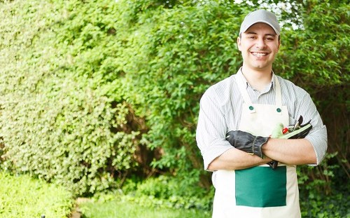 Garden maintenance team wearing PPE while working