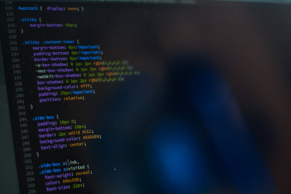 A computer screen displaying lines of code with syntax highlighting in various colors, including green, blue, purple, and white. The code appears to be part of a web application's backend, showing ele